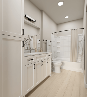 A white bathroom with a toilet and a shower.